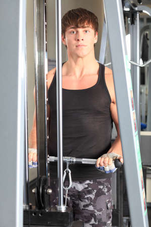 Sporty man in the gym centre.