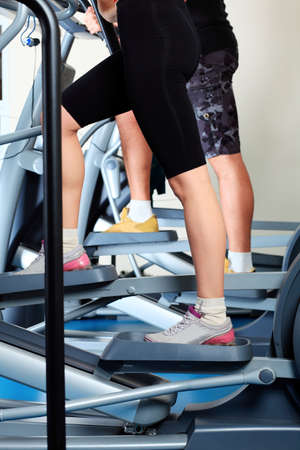 Couple of a sporty young people in the gym. 
