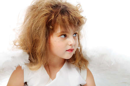 Beautiful little angel isolated over white background.の写真素材