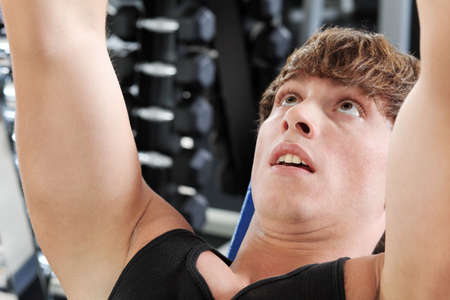 Sporty man in the gym centre.