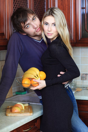 Happy young couple having a rest at home.の写真素材