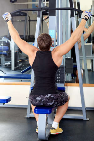 Sporty man in the gym centre.