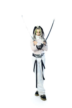 Shot of a stylish male warrior standing with his sword. Isolated over white background.