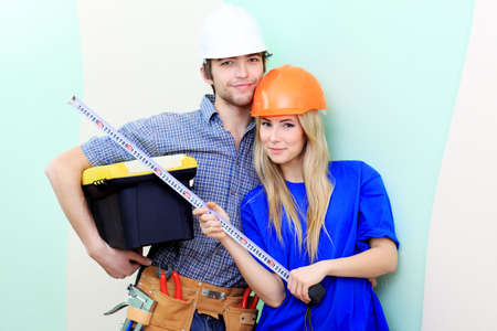Happy family making repairs at their new home.の写真素材