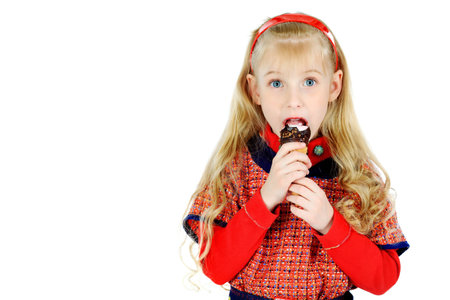 Little girl is eating chocolate ice-cream. Isolated over white background.