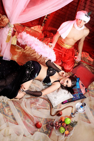 Shot of a couple in oriental costumes. 
