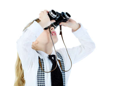 Shot of a girl looking up through a binocular. Isolated over white background.の写真素材