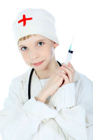 Shot of a little boy in a doctors uniform. Isolated over white background.の写真素材