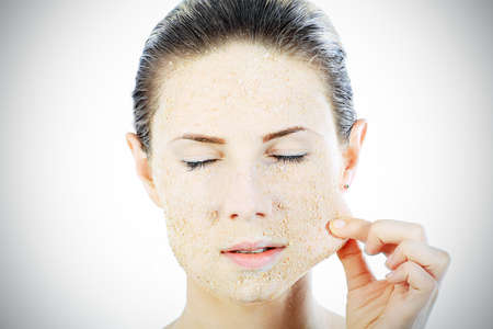 Portrait of a woman with beauty mask on her face. Spa, healthcare.の写真素材