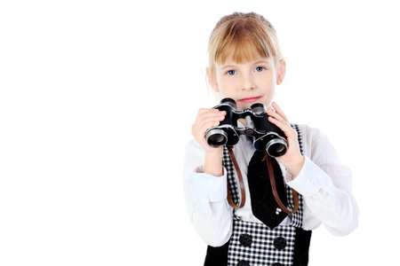 Shot of a girl with a binocular. Isolated over white background.の写真素材