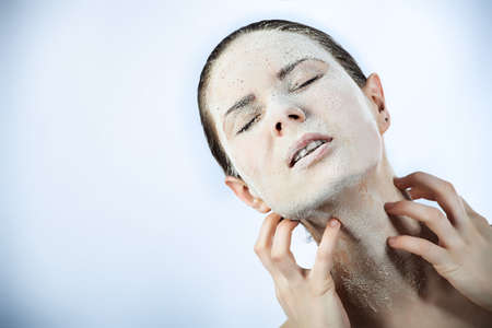 Portrait of a woman with beauty mask on her face. Spa, healthcare.の写真素材