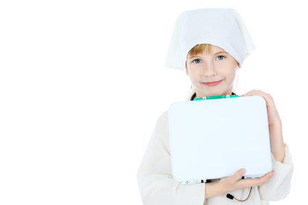 Shot of a little girl in a doctors uniform. Isolated over white background.の写真素材