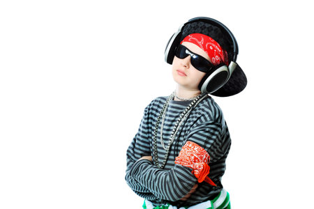 Shot of a trendy teenager listening to music in headphones. Isolated over white background.