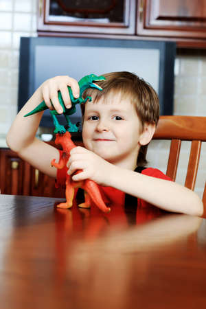 Little boy is playing with his toys at home.の写真素材