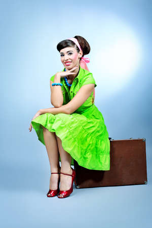 Portrait of a beautiful young woman in retro style. の写真素材