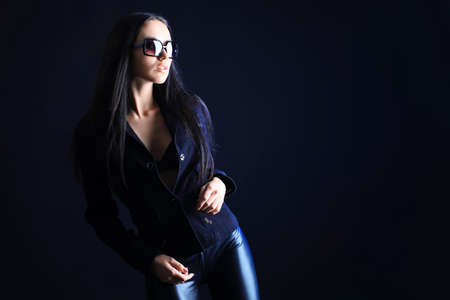  model is  posing over black backgroundの写真素材