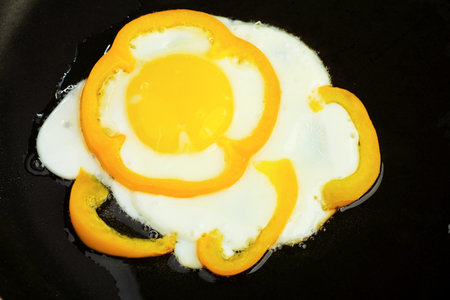Fried eggs with yellow pepper.の写真素材