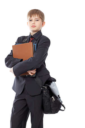 Educational theme: boy teenager with books. Isolated over white background.の写真素材