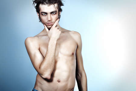 Portrait of a handsome muscular young man. Shot in a studio.の写真素材