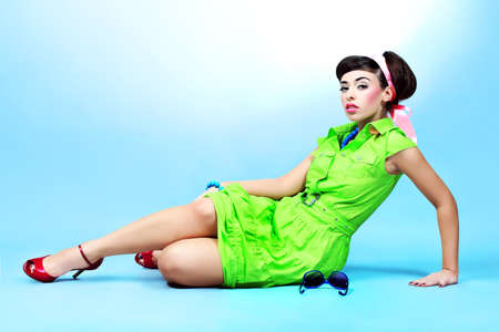 Portrait of a beautiful young woman in retro style. の写真素材