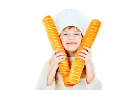 Shot of a little kitchen girl in a white uniform. Isolated over white background.の写真素材