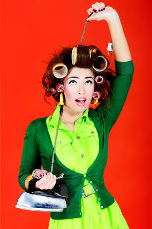 Shot of a funny  woman housewife dressed in retro style. の写真素材