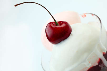 Close-up of a cherry ice-cream. Isolated over white background.の写真素材