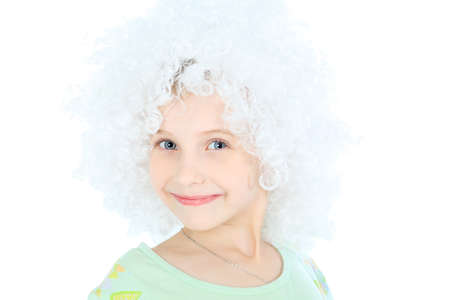 Portrait of a smiley 6 years old girl in white wig. Isolated over white background. の写真素材