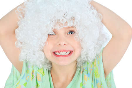 Portrait of a smiley 6 years old girl in white wig. Isolated over white background. の写真素材