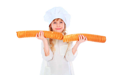 Shot of a little kitchen girl in a white uniform. Isolated over white background.の写真素材