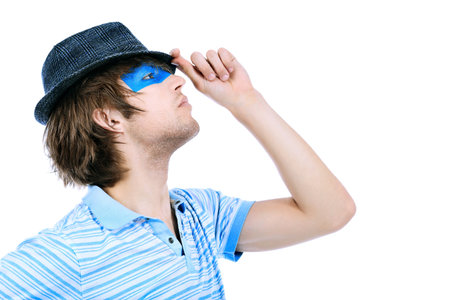 Shot of a stylish young man with painted eyes. Isolated over white background.の写真素材