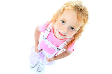 Portrait of a pretty curious  red-haired girl. Isolated over white background.の写真素材
