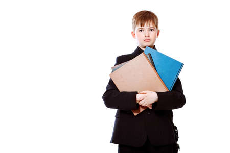 Educational theme: boy teenager with books. Isolated over white background.の写真素材