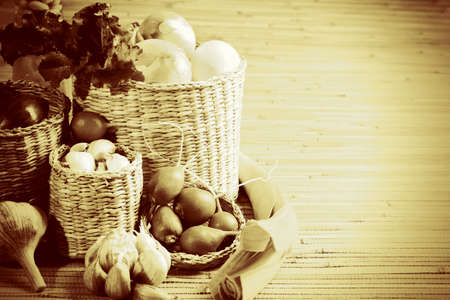 Rural composition with fresh greens, garlic and onionsの写真素材