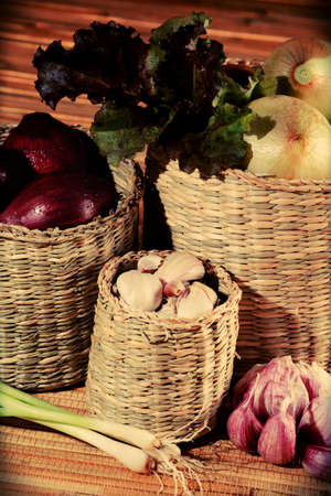 Rural composition with fresh greens, garlic and onionsの写真素材