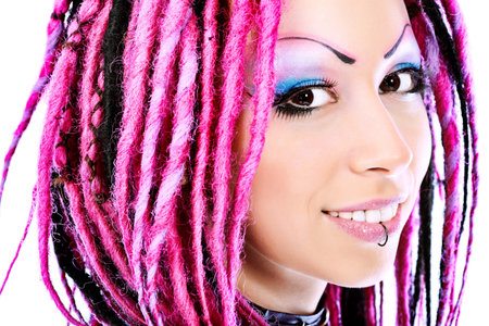 Beautiful young woman with pink dreadlocks. Isolated over white background.