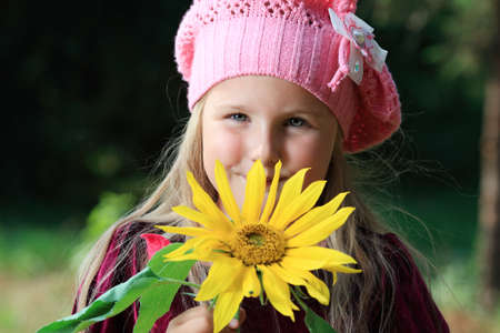 Beautiful little girl walking outdoor. Retro style.の写真素材