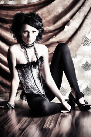 Beautiful fashionable woman over vintage background.の写真素材