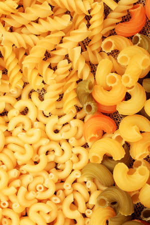 Food theme: uncooked pasta background.の写真素材