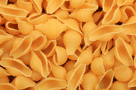 Food theme: uncooked pasta background.