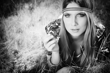 Beautiful young woman hippie posing outdoor.の写真素材