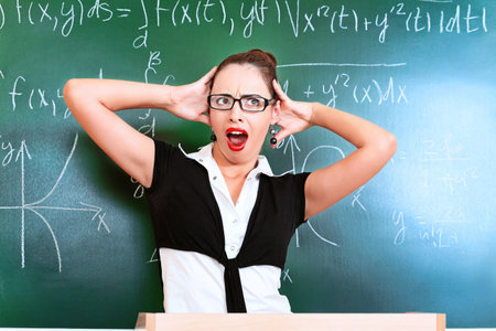 Educational theme: portrait of emotional teacher over blackboard.