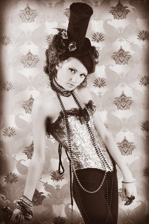 Beautiful fashionable woman over vintage background.の写真素材
