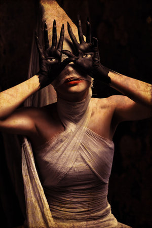 Shot of a twilight girl in white dress. Halloween, horror.