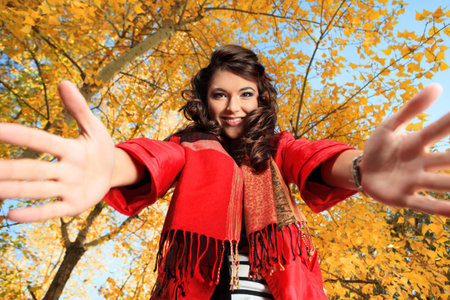 Young pretty woman at the autumn park.の写真素材