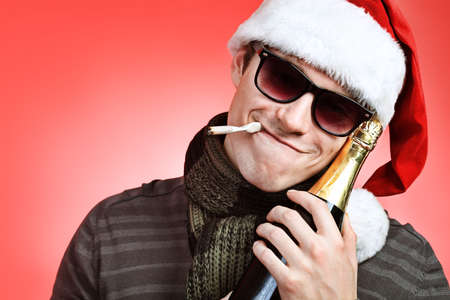 Portrait of a handsome young man in Santa Claus hat. Christmas.の写真素材