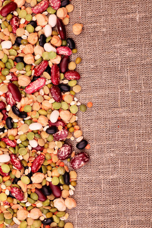 Food theme: kidney bean, lentil, peas and chick-pea background.