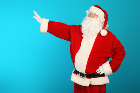 Portrait of Santa Claus over blue background. Christmas.の写真素材