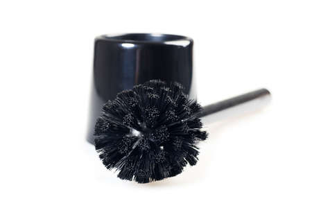Close-up of a black toilet brush. Isolated over white blackground.の写真素材