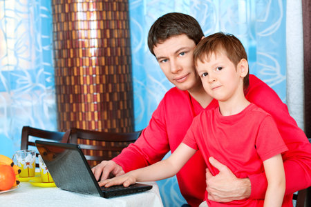Happy father with his son at home.の写真素材